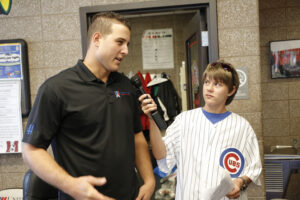 Aaron Hanania interviewing Cubs First baseman Anthony Rizzo in 2015
