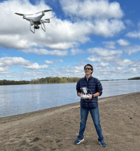 Aaron flying a drone along the Mississippi River near the Quad Cities. [Photo courtesy of Aaron Hanania]